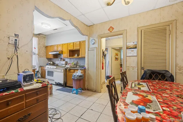 a view of a hallway with closet and a window