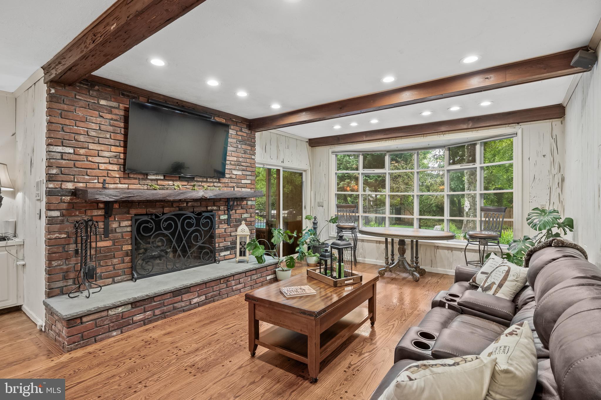 21 Robin Road Moorestown, NJ 08057 - Photo 17 of 82 a living room with furniture a flat screen tv and a fireplace