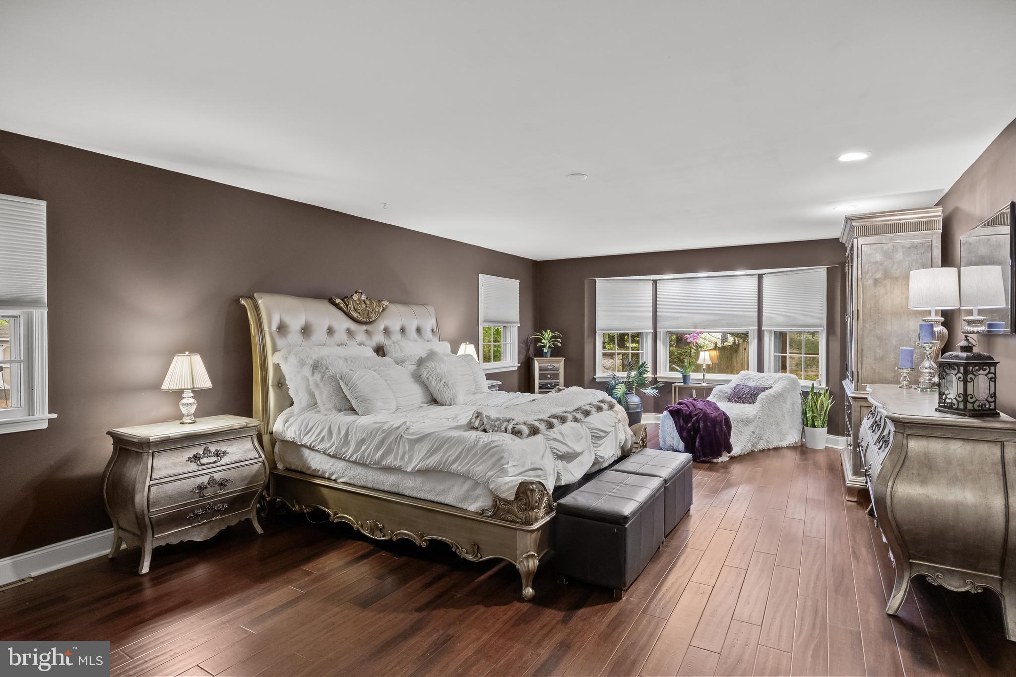 21 Robin Road Moorestown, NJ 08057 - Photo 37 of 82 a spacious bedroom with a bed couch and a large window