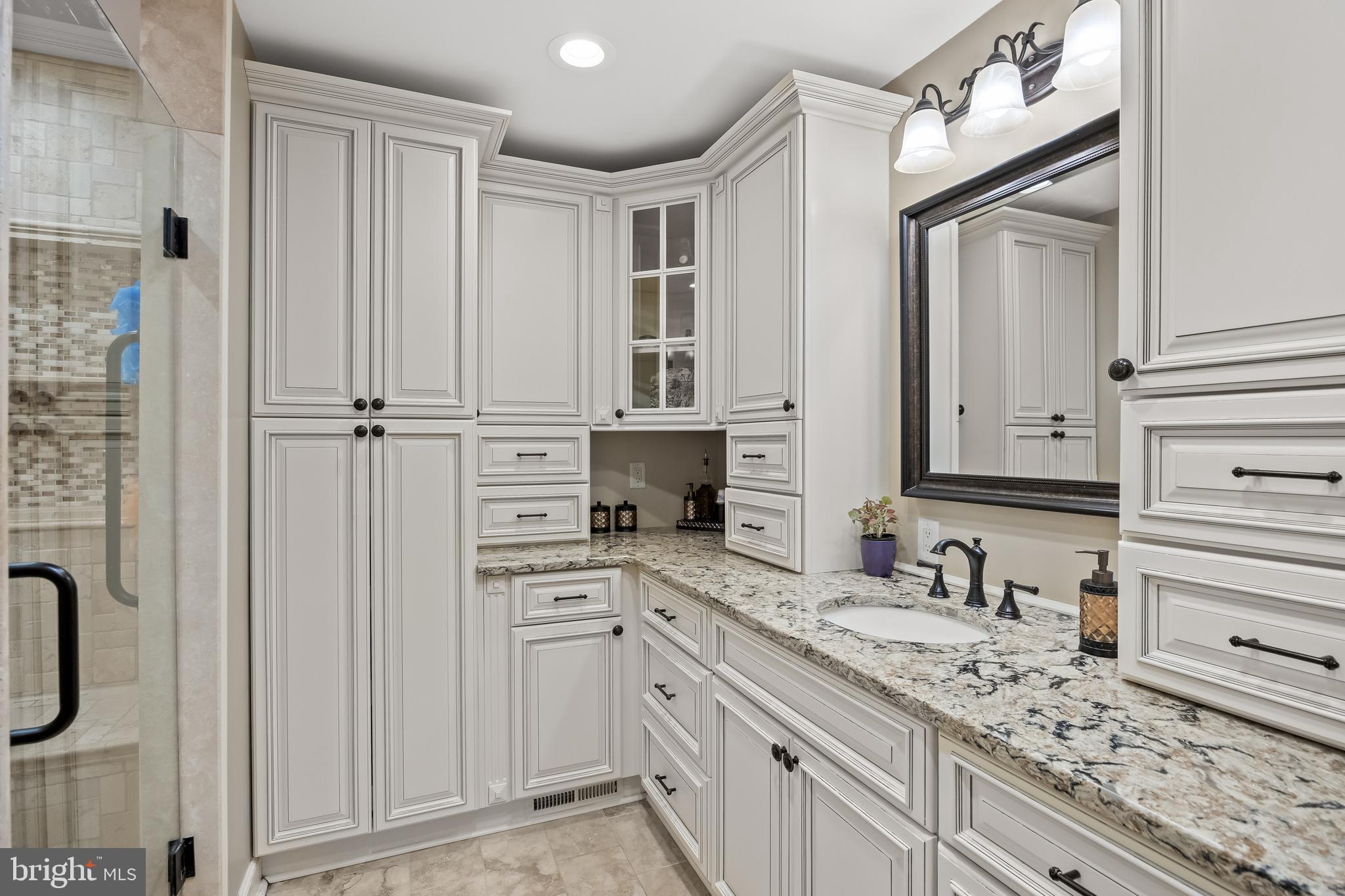 21 Robin Road Moorestown, NJ 08057 - Photo 40 of 82 a bathroom with a granite countertop sink and a mirror