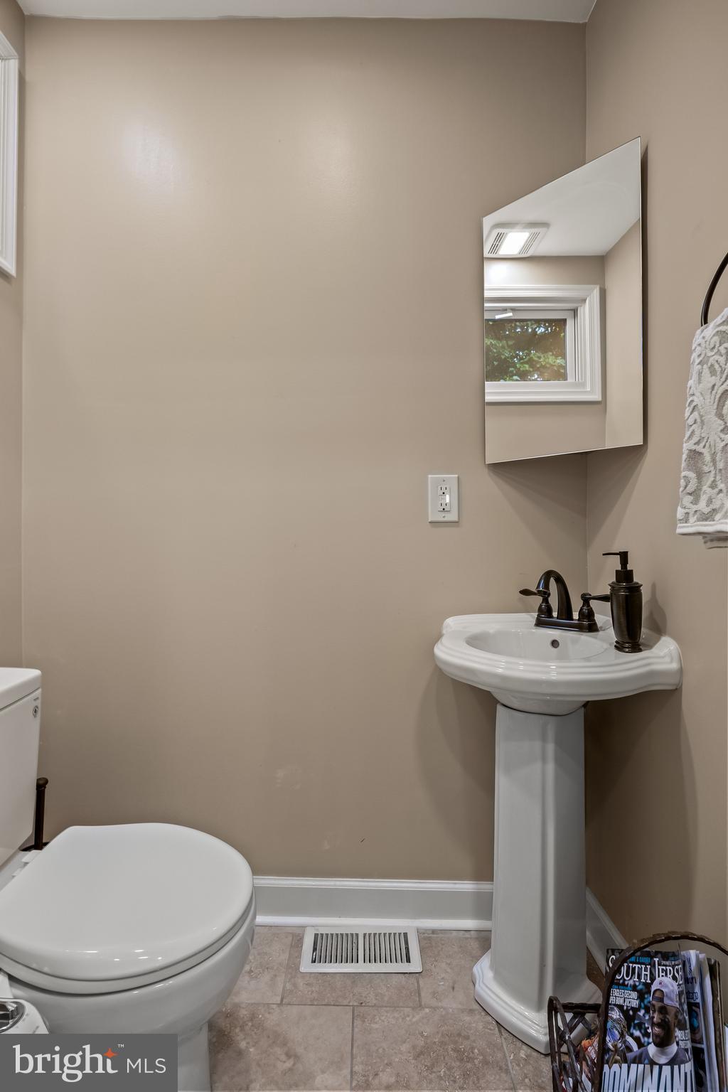 21 Robin Road Moorestown, NJ 08057 - Photo 42 of 82 a bathroom with a sink a toilet and mirror