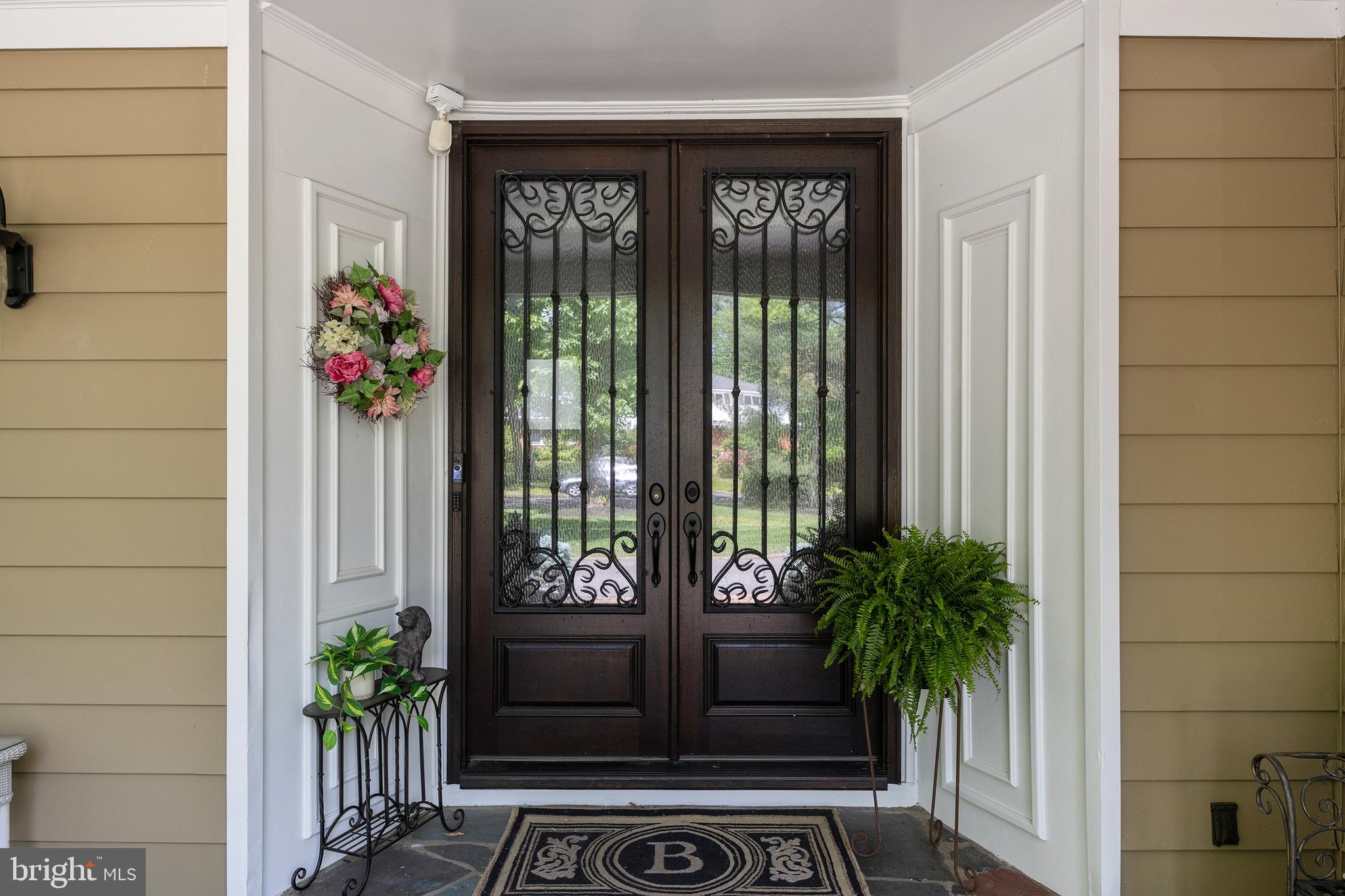 21 Robin Road Moorestown, NJ 08057 - Photo 6 of 82 a potted plant sitting in front of a door