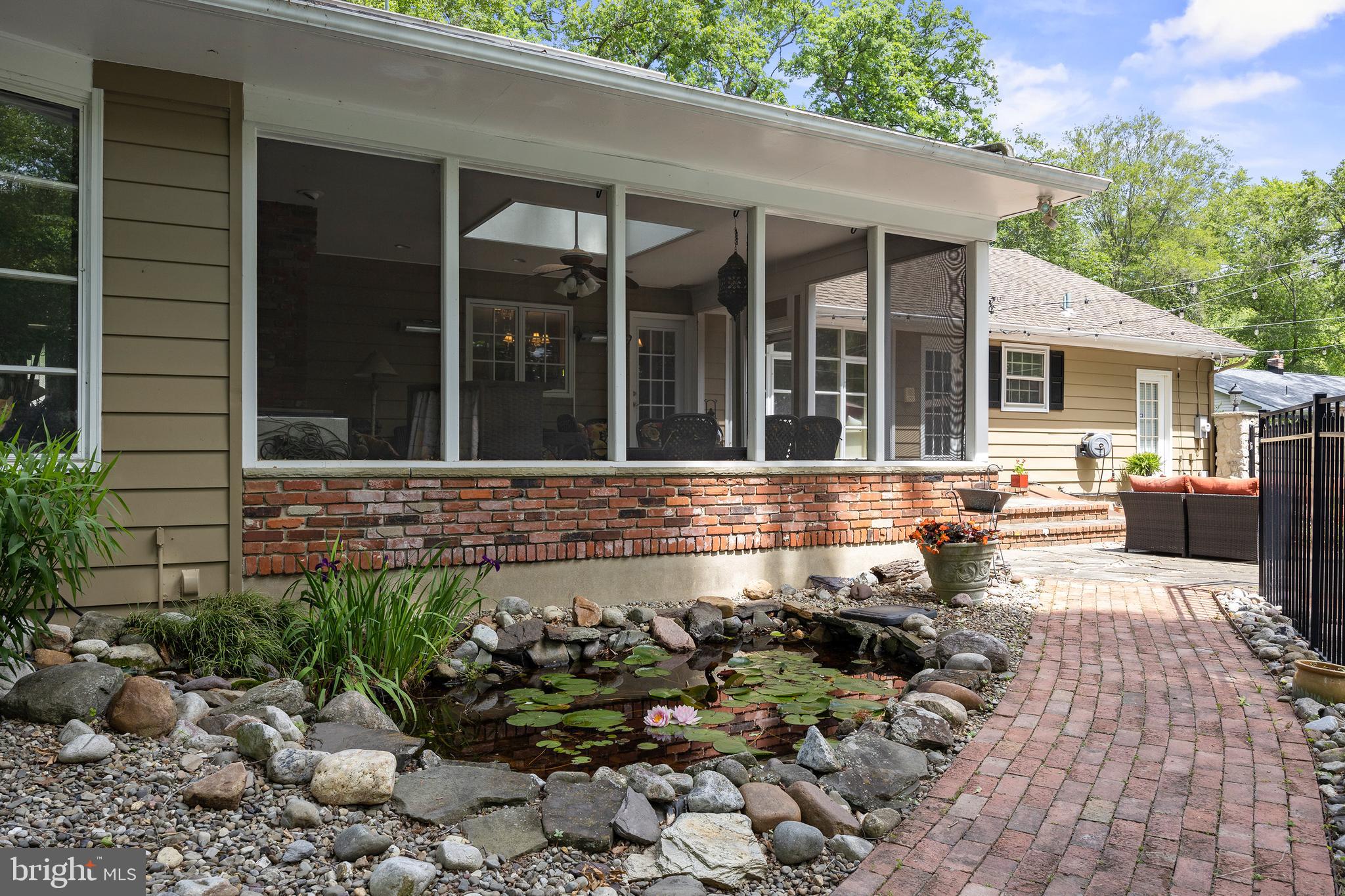 21 Robin Road Moorestown, NJ 08057 - Photo 75 of 82 a front view of a house with a yard outdoor seating and covered with trees