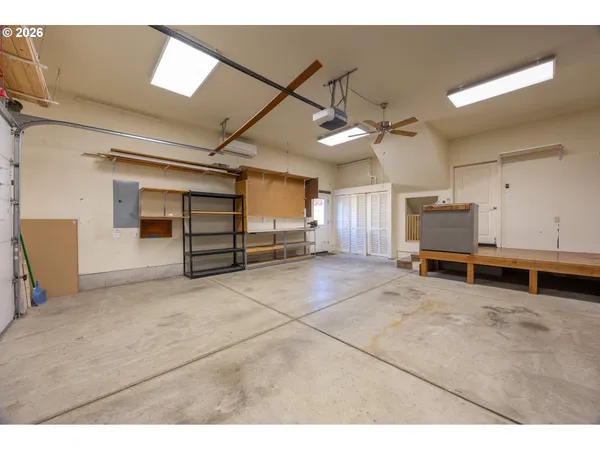 a view of a livingroom with furniture and a ceiling fan