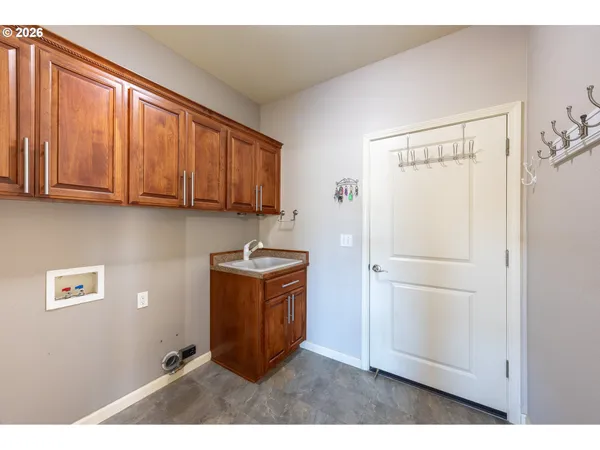 a room with refrigerator and cabinet