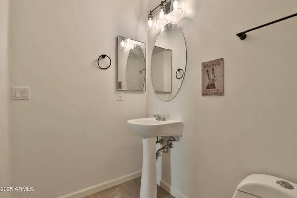 a bathroom with a sink and mirror