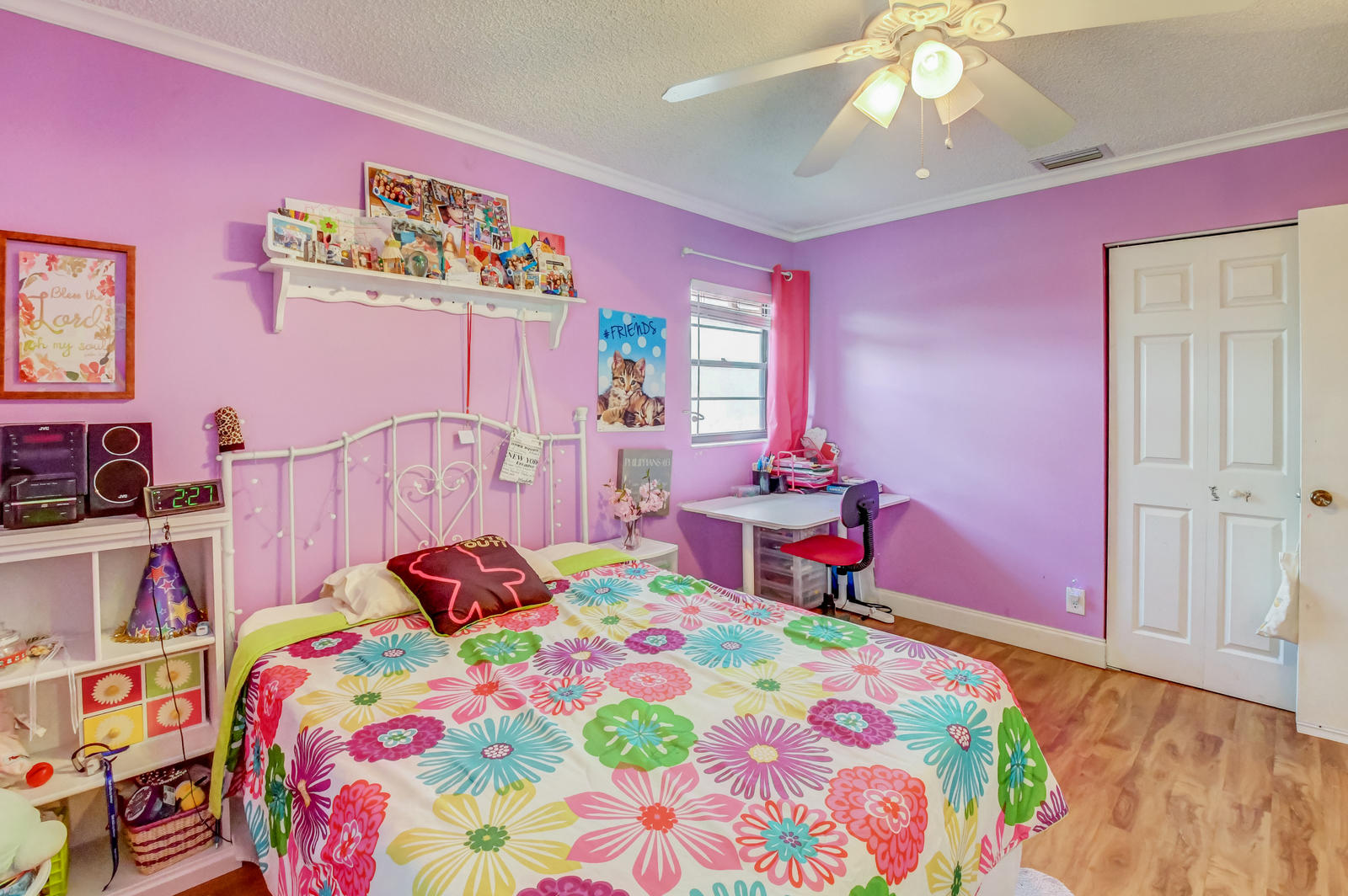 11682 Springflower Place Boca Raton, FL 33428 - Photo 27 of 66 a bedroom with bed and a chandelier