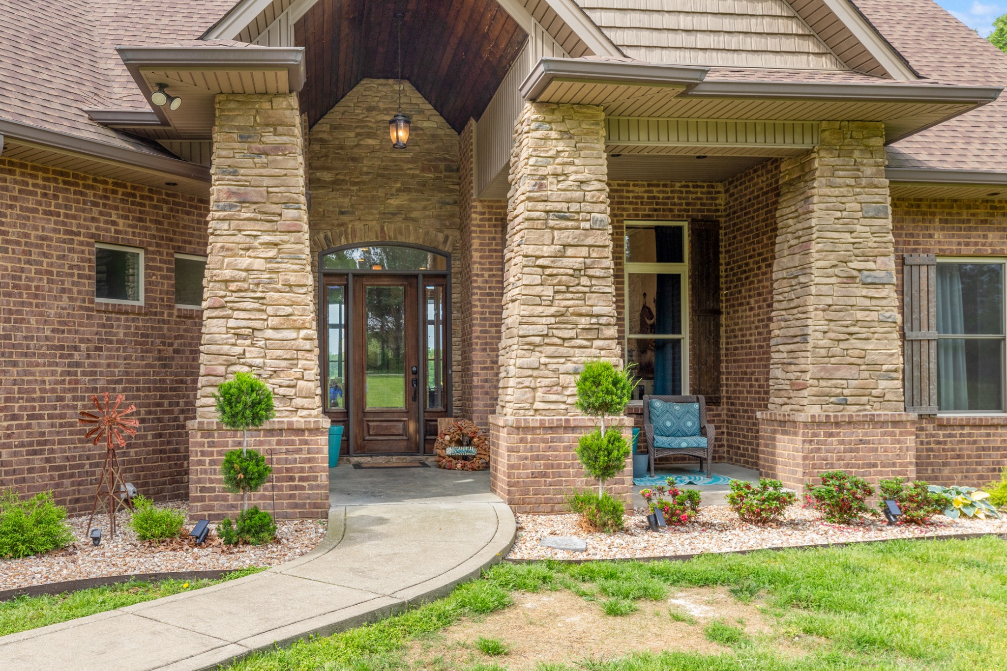 a front view of a house with garden