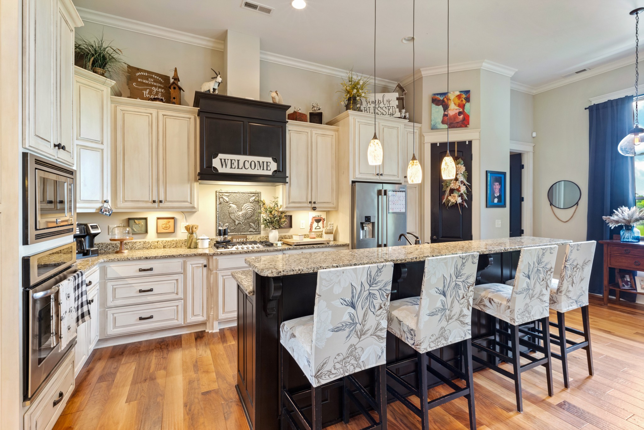 532 South Tidwell Road Bon Aqua, TN 37025 - Photo 26 of 100 a large kitchen with granite countertop a stove a sink a dining table and chairs