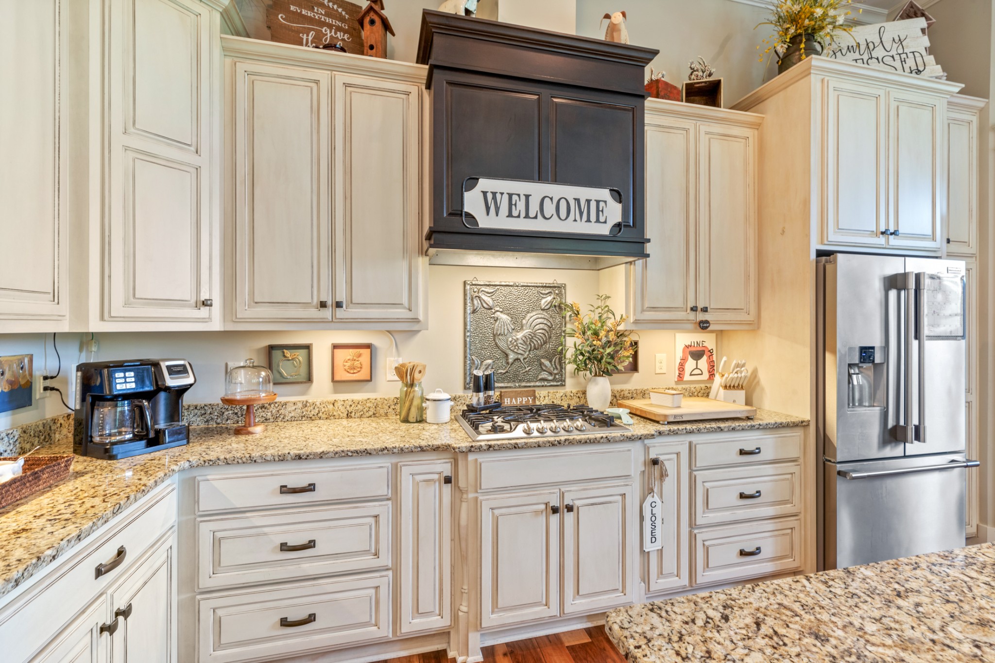 532 South Tidwell Road Bon Aqua, TN 37025 - Photo 30 of 100 a kitchen with stainless steel appliances granite countertop a refrigerator and a stove top oven