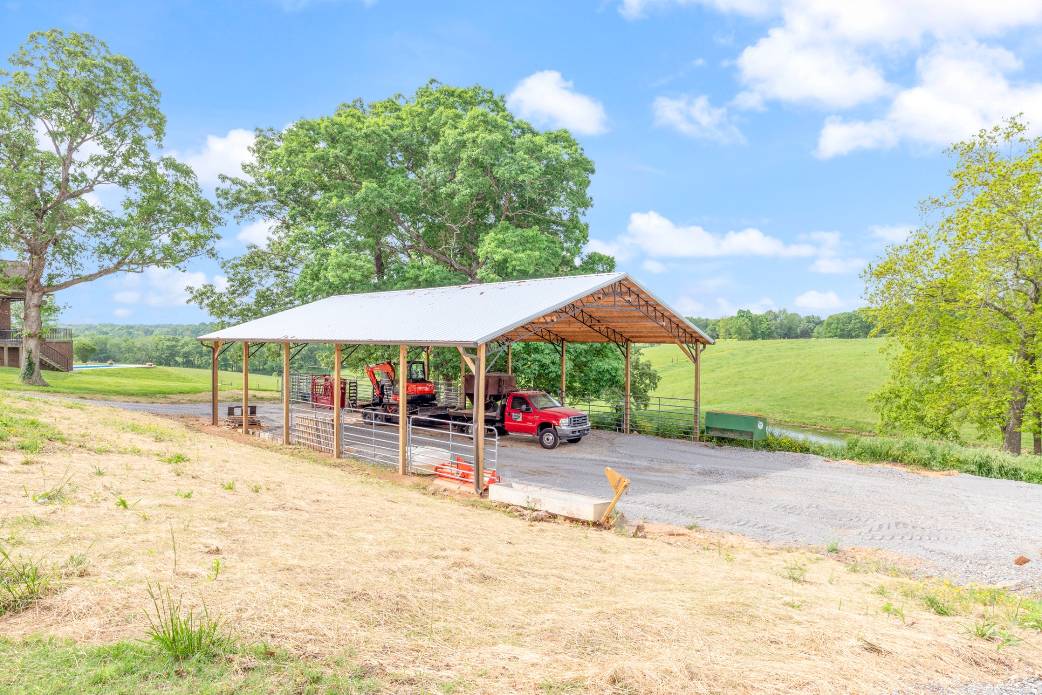 532 South Tidwell Road Bon Aqua, TN 37025 - Photo 75 of 100 a backyard of a house with barbeque oven table and chairs