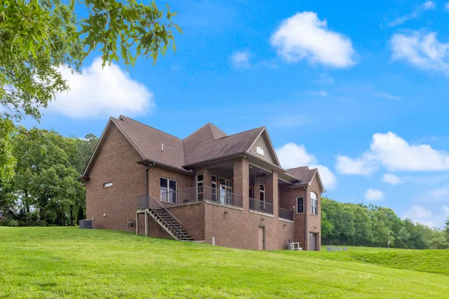 a view of a swimming pool and an outdoor seating