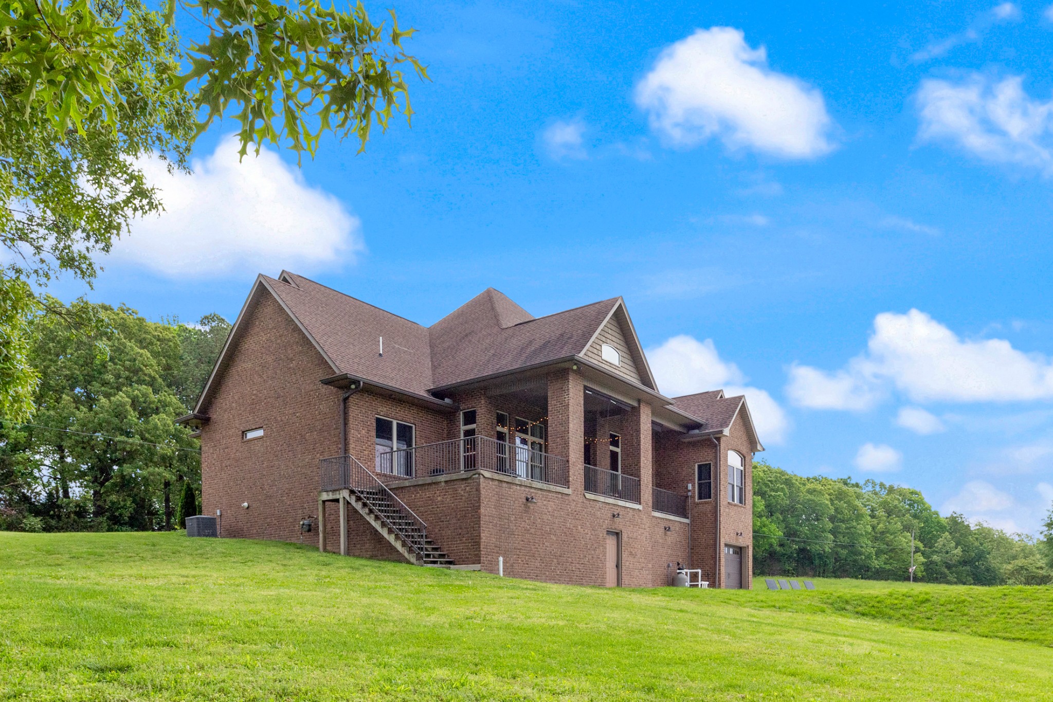 532 South Tidwell Road Bon Aqua, TN 37025 - Photo 9 of 100 a front view of a house with a garden and yard