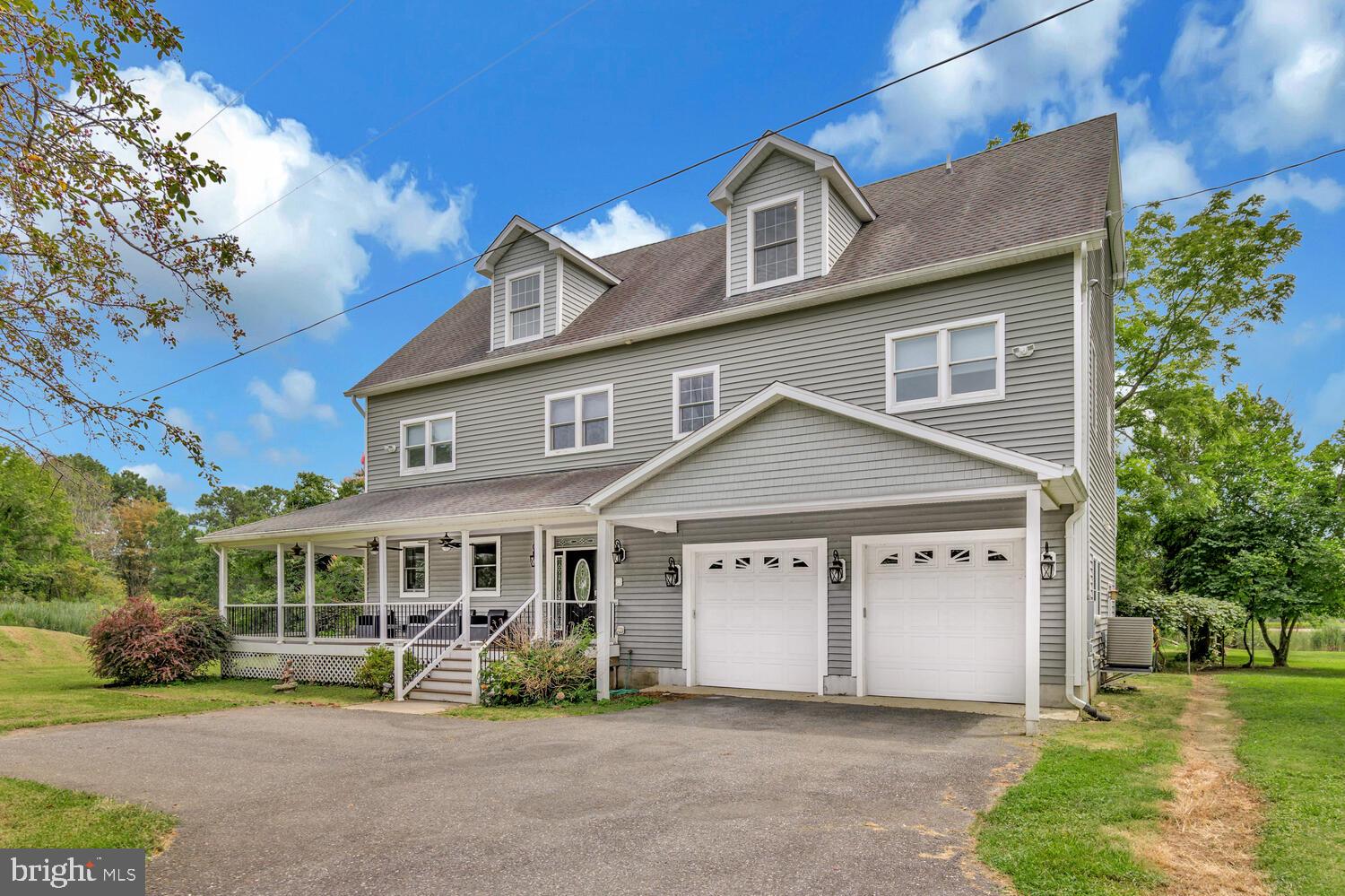 50333 Scotland Beach Road Scotland, MD 20687 - Photo 2 of 80 a front view of a house with garden