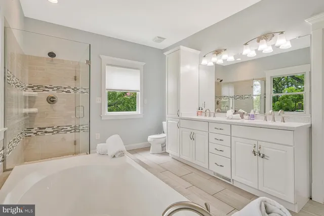 a utility room with dryer and window