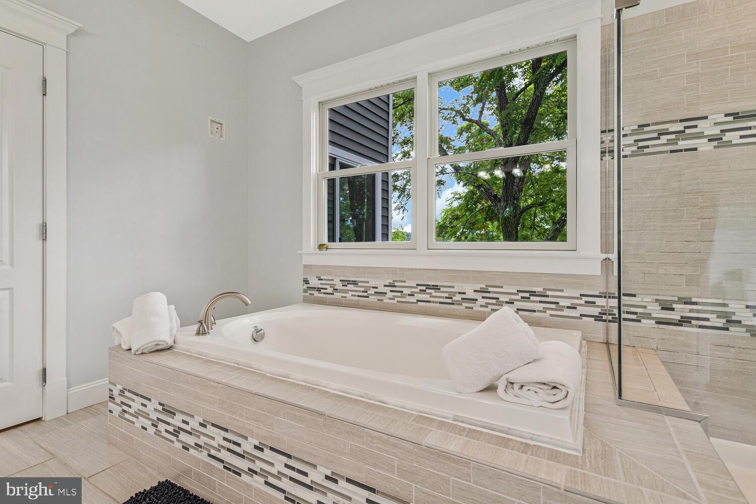 50333 Scotland Beach Road Scotland, MD 20687 - Photo 28 of 80 a bathroom with a bathtub and next to a window