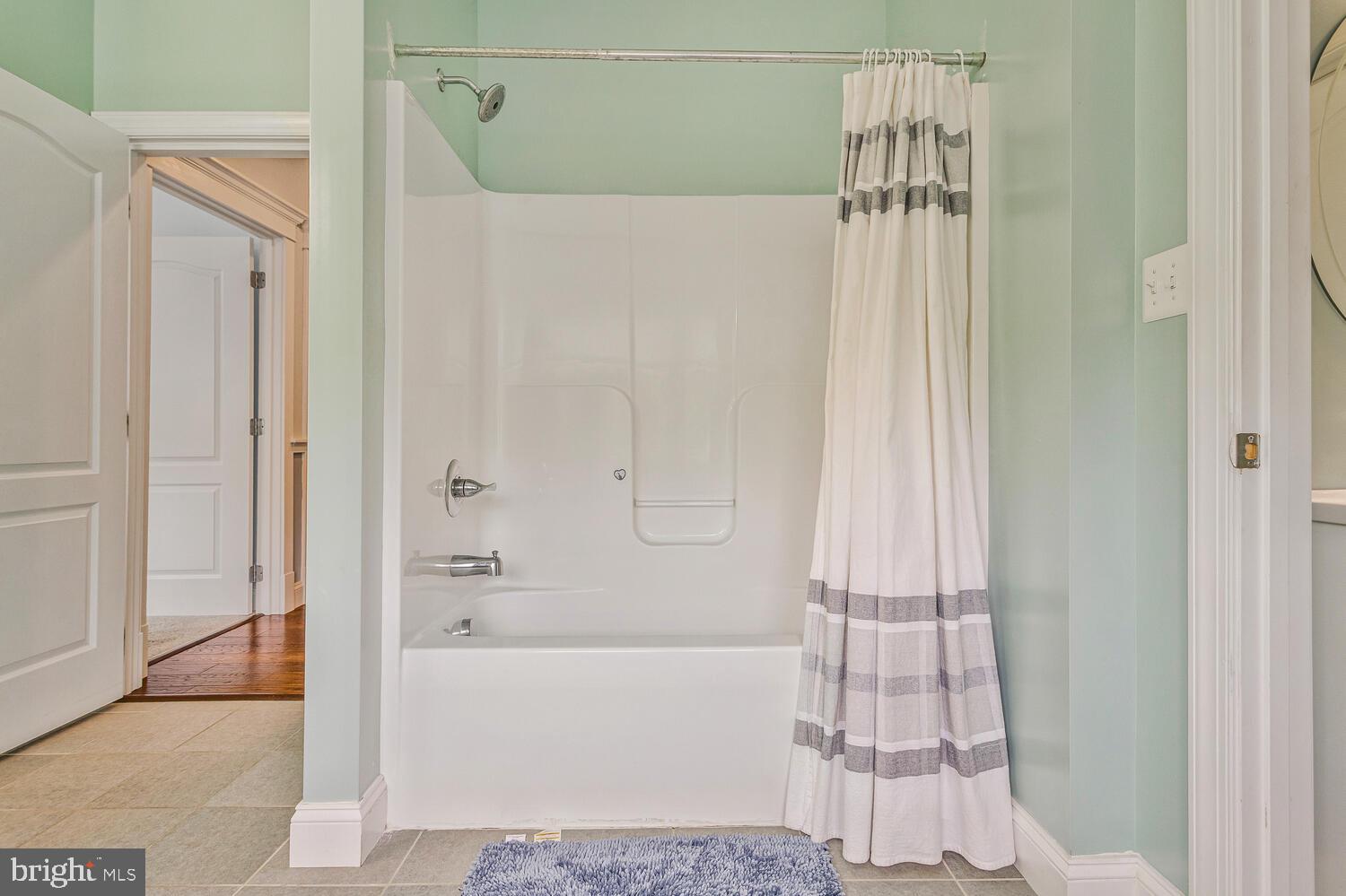 50333 Scotland Beach Road Scotland, MD 20687 - Photo 36 of 80 a bathroom with a bathtub and a shower