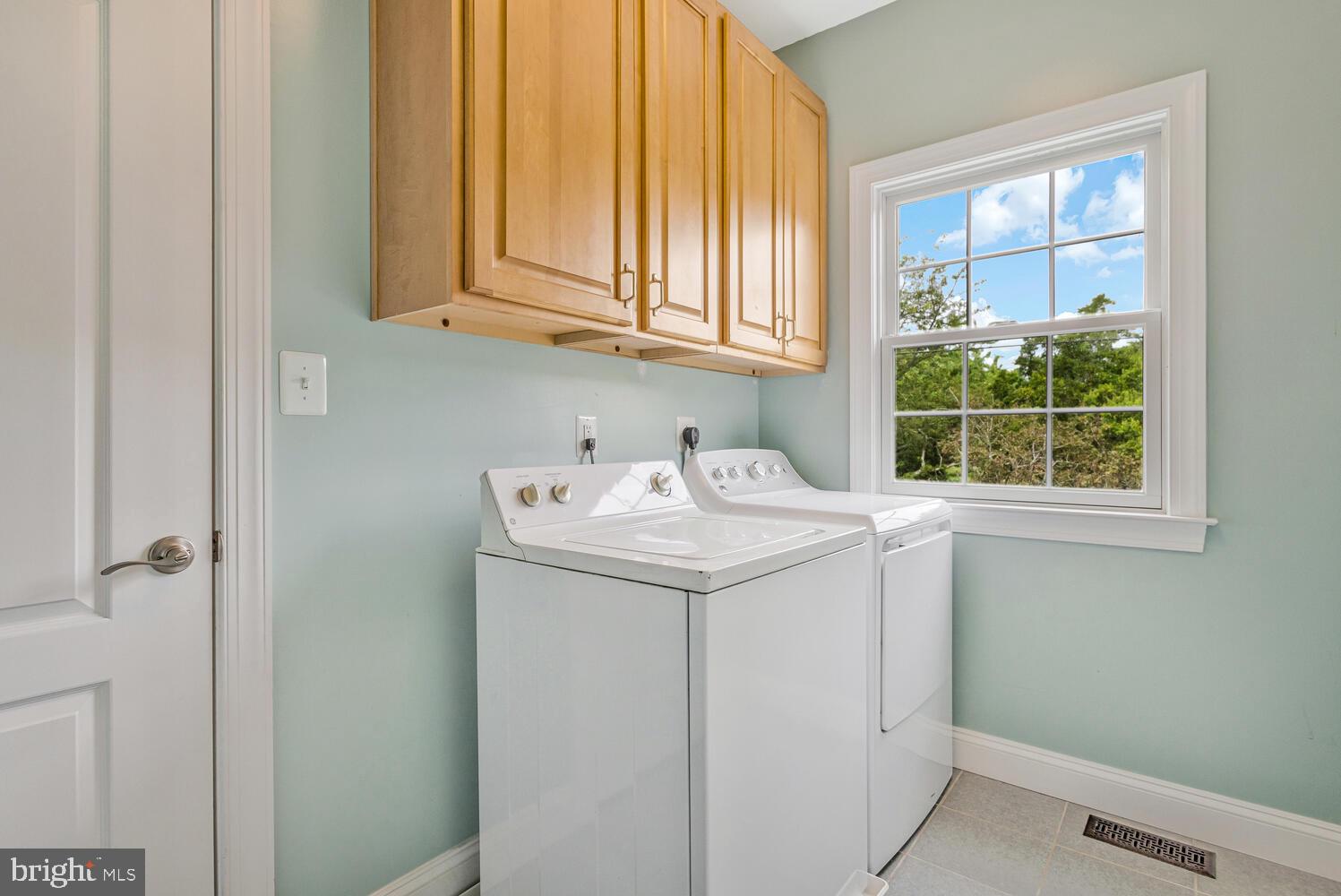 50333 Scotland Beach Road Scotland, MD 20687 - Photo 39 of 80 a utility room with dryer and window