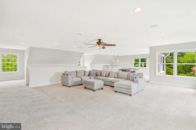 a view of a house with swimming pool and porch