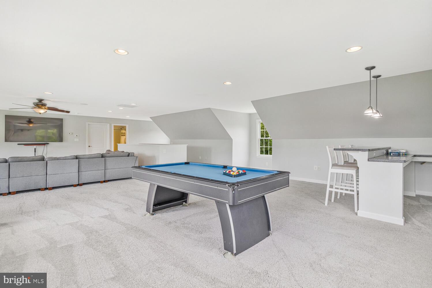 50333 Scotland Beach Road Scotland, MD 20687 - Photo 47 of 80 a living room with furniture a table and kitchen view