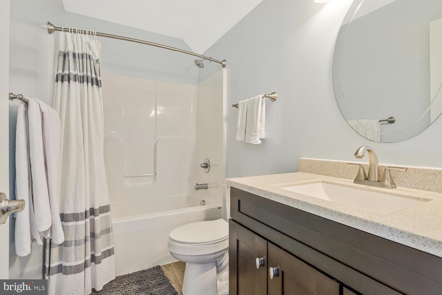 50333 Scotland Beach Road Scotland, MD 20687 - Photo 50 of 80 a bathroom with a sink a toilet a mirror and shower