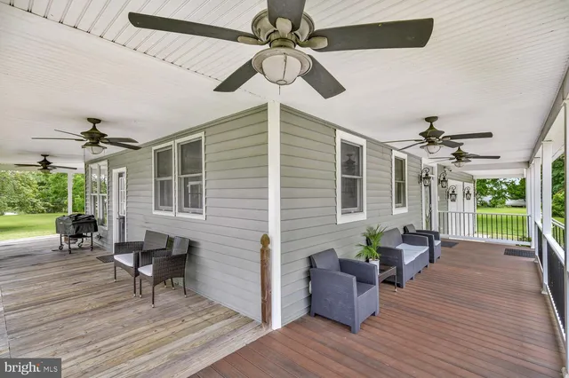 a living room with furniture and windows