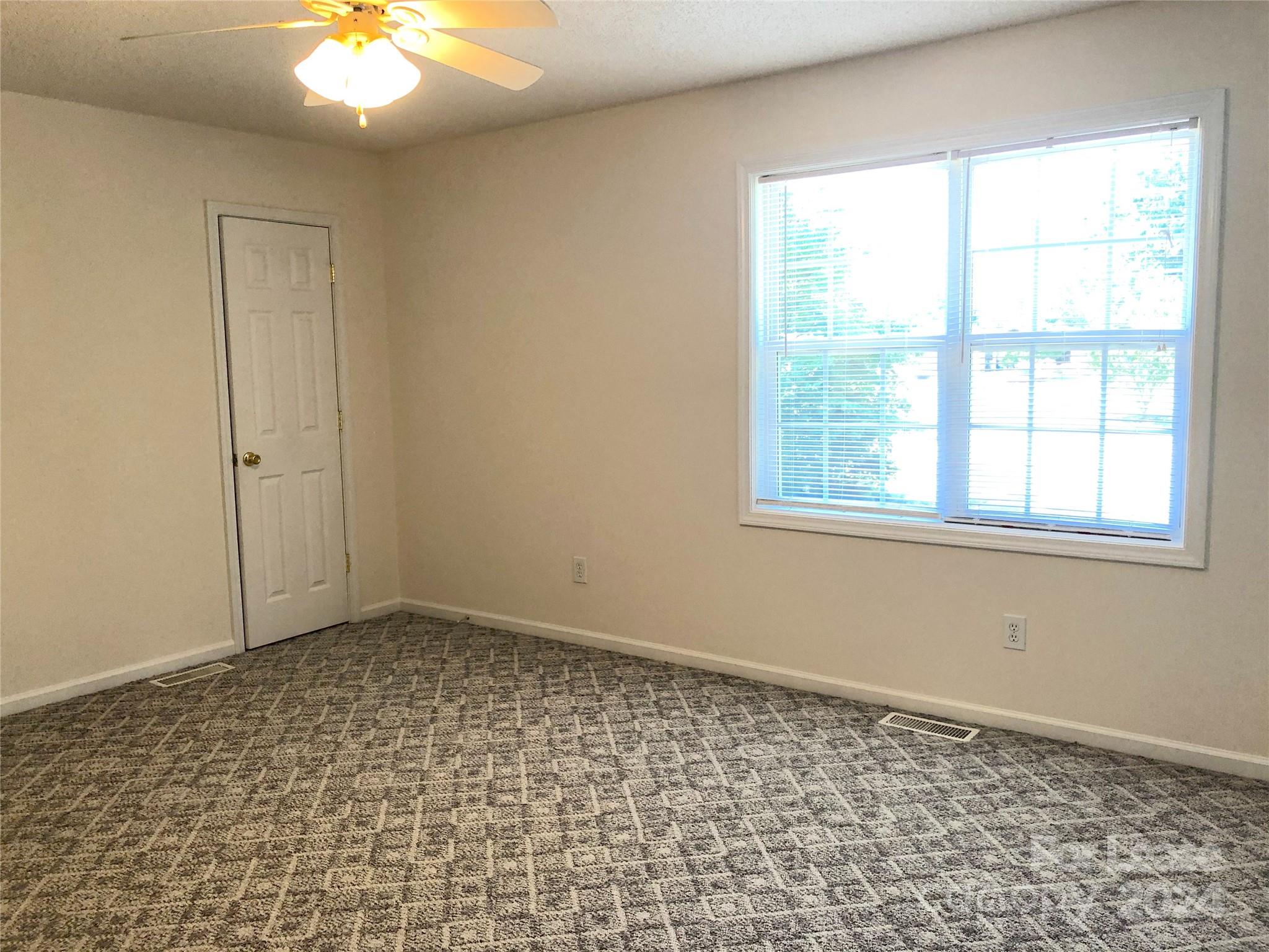 6381 Kidville Road Denver, NC 28037 - Photo 13 of 19 an empty room with a window