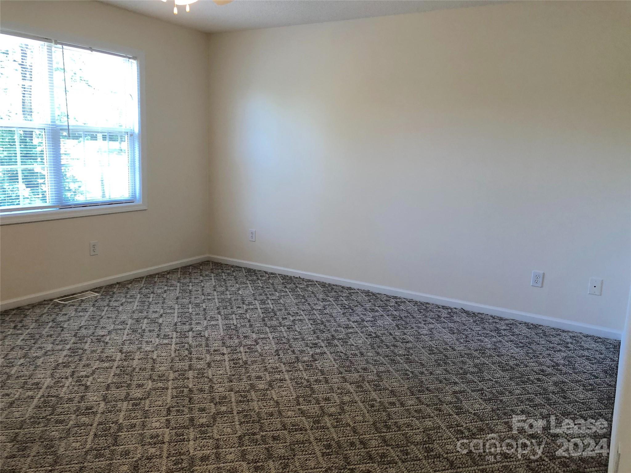 6381 Kidville Road Denver, NC 28037 - Photo 14 of 19 an empty room with a window