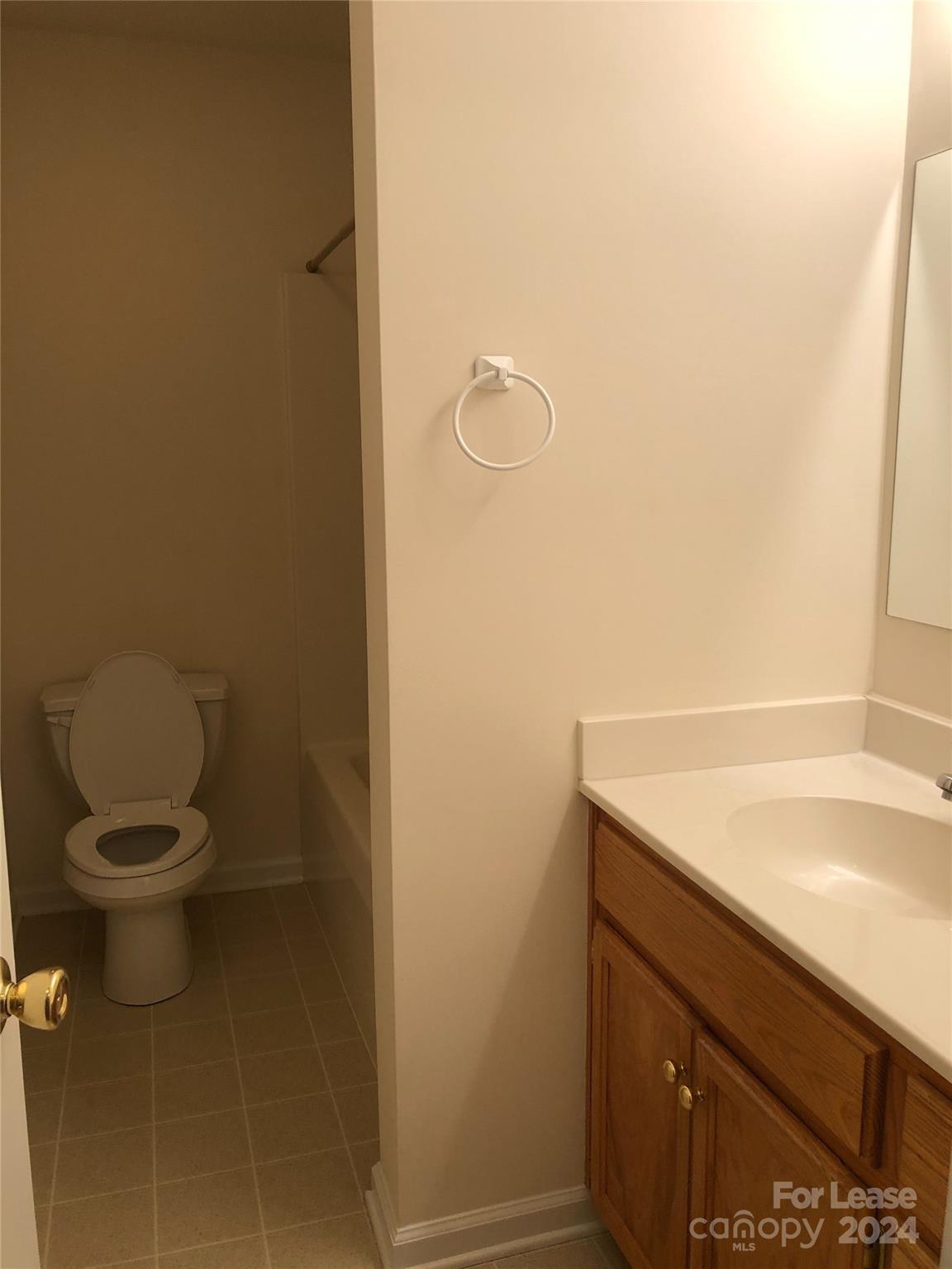 6381 Kidville Road Denver, NC 28037 - Photo 17 of 19 a bathroom with a sink and toilet
