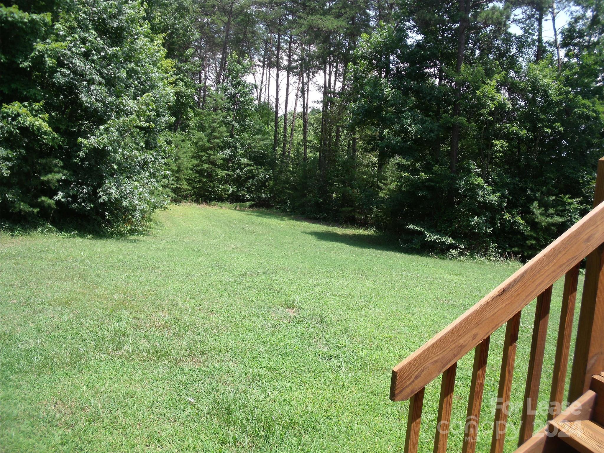 6381 Kidville Road Denver, NC 28037 - Photo 19 of 19 a balcony with trees in front of it