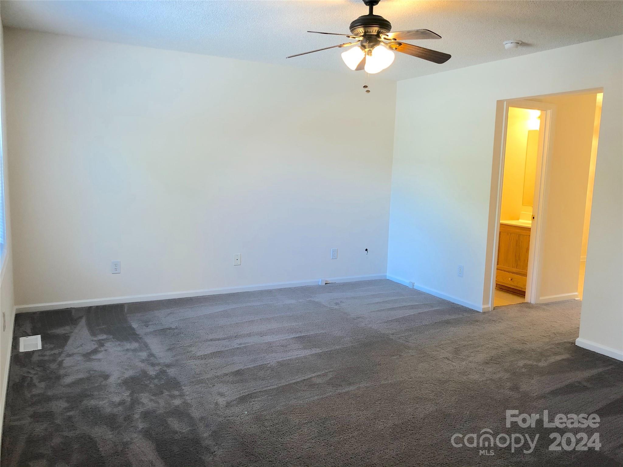 6381 Kidville Road Denver, NC 28037 - Photo 8 of 19 a view of an empty room with a window