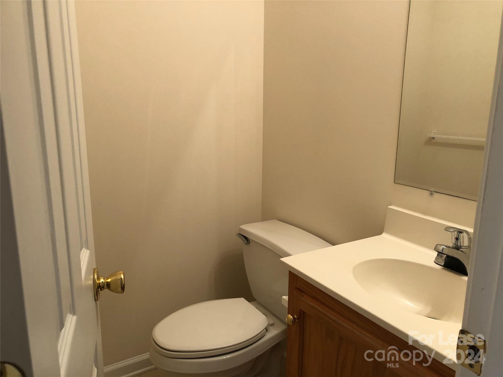 6381 Kidville Road Denver, NC 28037 - Photo 10 of 19 a white toilet sitting next to a bathroom sink