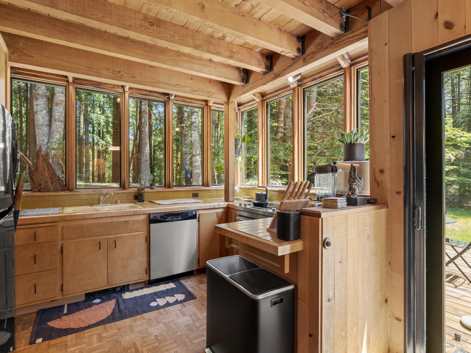 36778 Timber Ridge Road The Sea Ranch, CA 95497 - Photo 12 of 44 a kitchen with a sink stove and cabinets