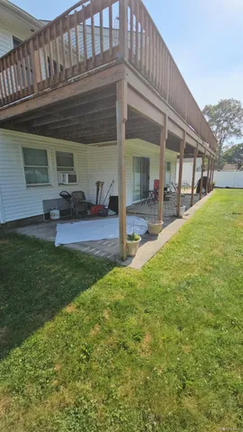 a view of a house with backyard porch and sitting area