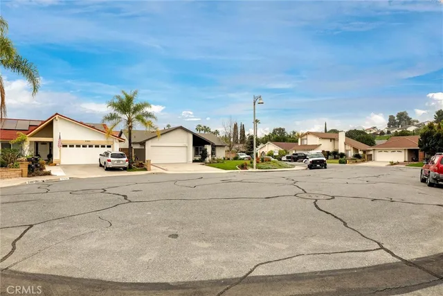 a view of multiple houses with a road