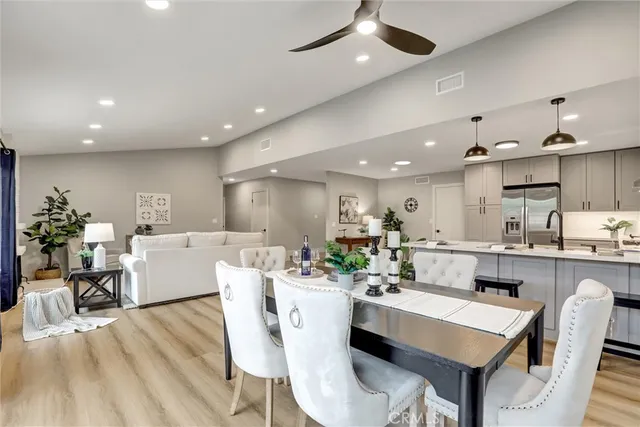 a large kitchen with a table and chairs in it