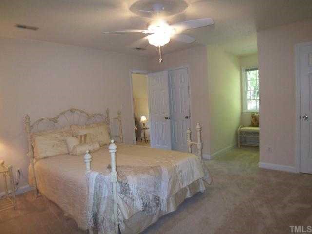 2809 Patrie Place Raleigh, NC 27613 - Photo 8 of 12 This spacious secondary bedroom also has a sitting room (where you can see a lamp) and two closets