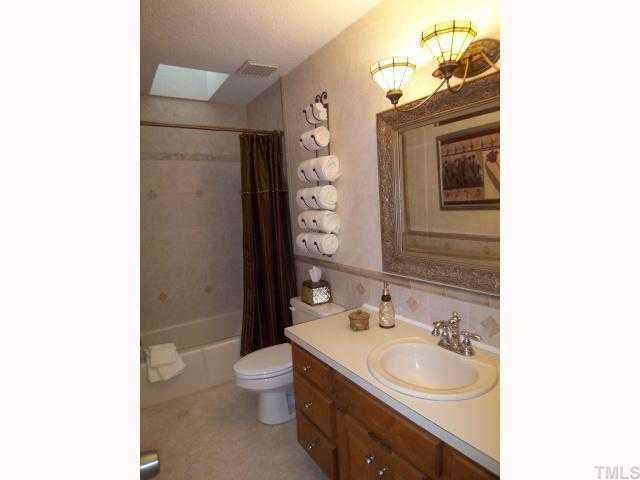 2809 Patrie Place Raleigh, NC 27613 - Photo 9 of 12 Updated hall bath with a skylight