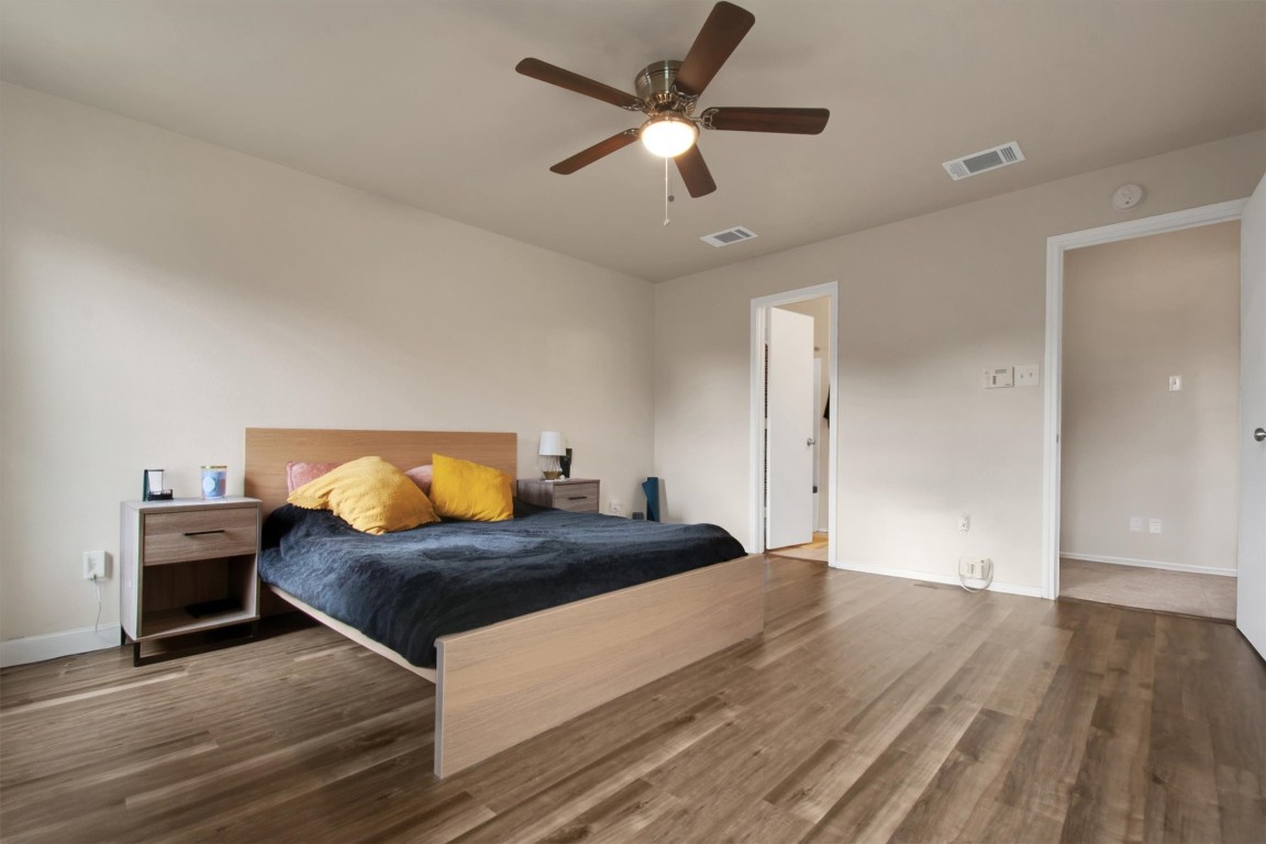 18205 Topsail Street Manor, TX 78653 - Photo 16 of 29 Bedroom with wood finished floors and ceiling fan