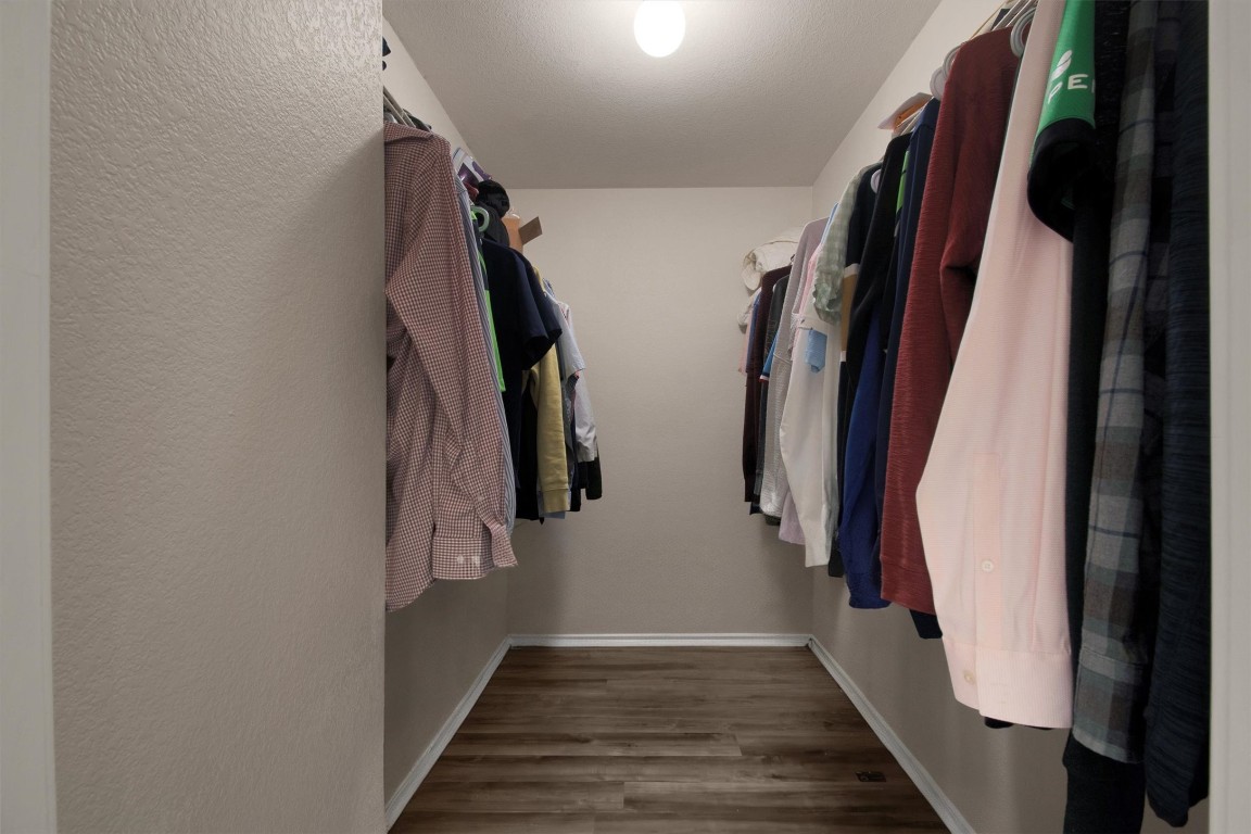 18205 Topsail Street Manor, TX 78653 - Photo 20 of 29 Walk in closet featuring light wood-style floors
