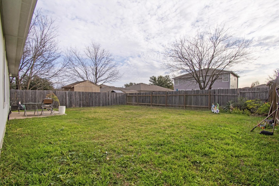 18205 Topsail Street Manor, TX 78653 - Photo 26 of 29 Fenced backyard featuring a patio area