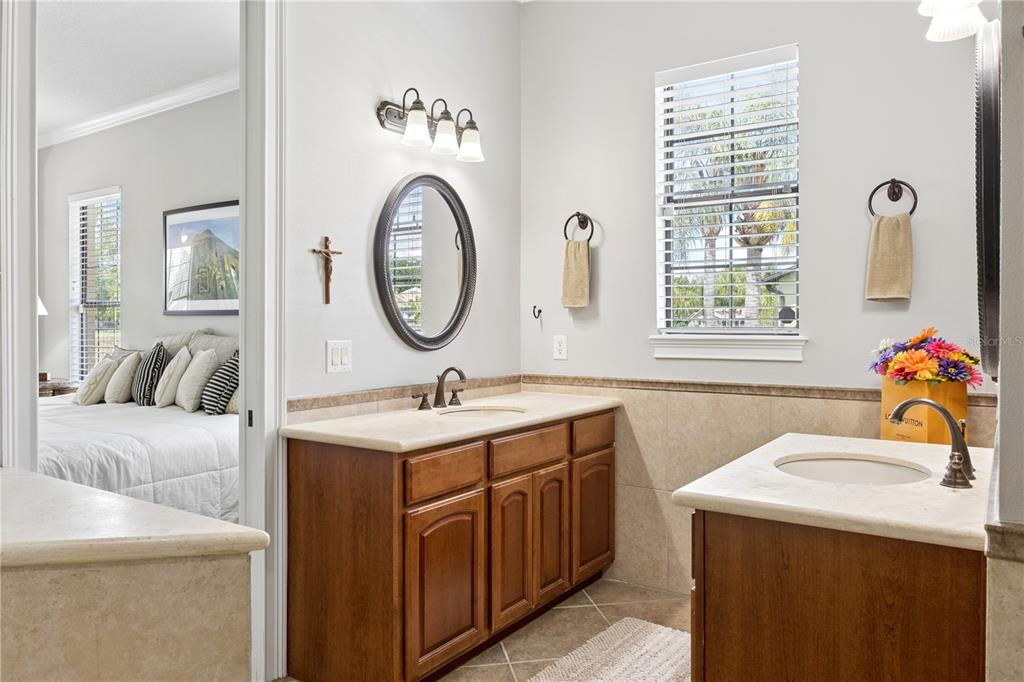 11325 Preston Cove Road Clermont, FL 34711 - Photo 22 of 58 a bathroom with a sink and a mirror