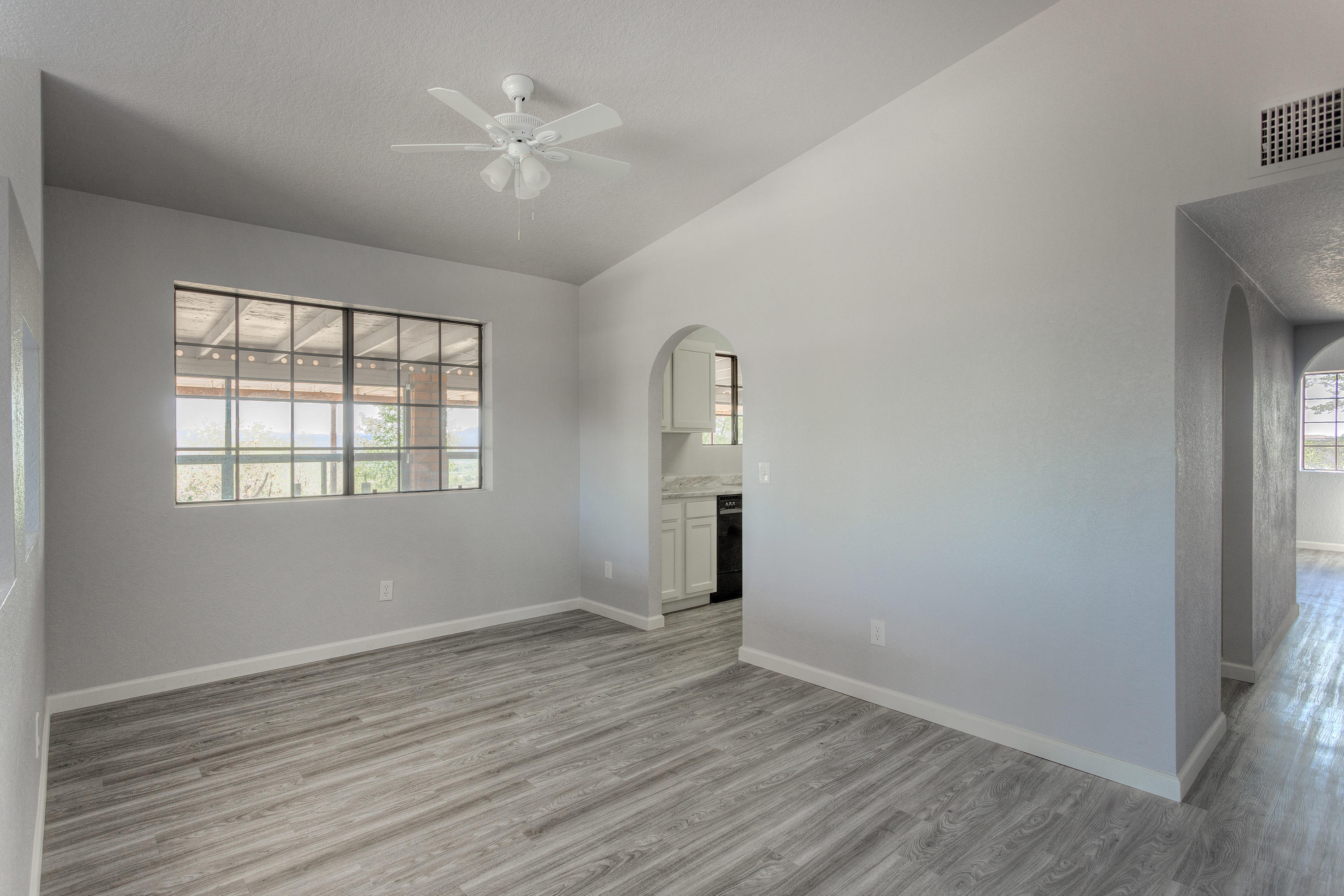 1096 Montosa Circulo Rio Rico, AZ 85648 - Photo 11 of 39 an empty room with wooden floor and windows