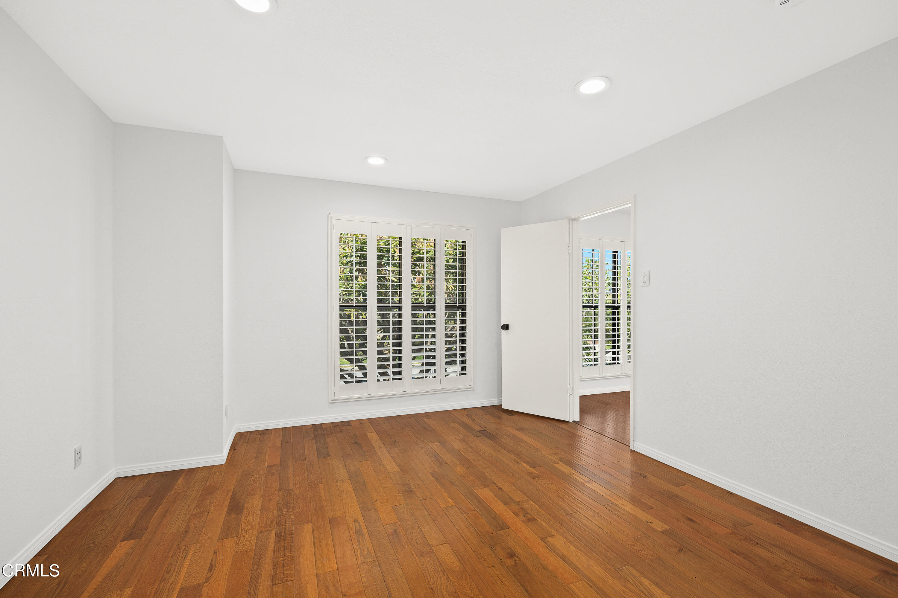 585 West Duarte Road, Unit 24A Arcadia, CA 91007 - Photo 15 of 23 an empty room with wooden floor and windows