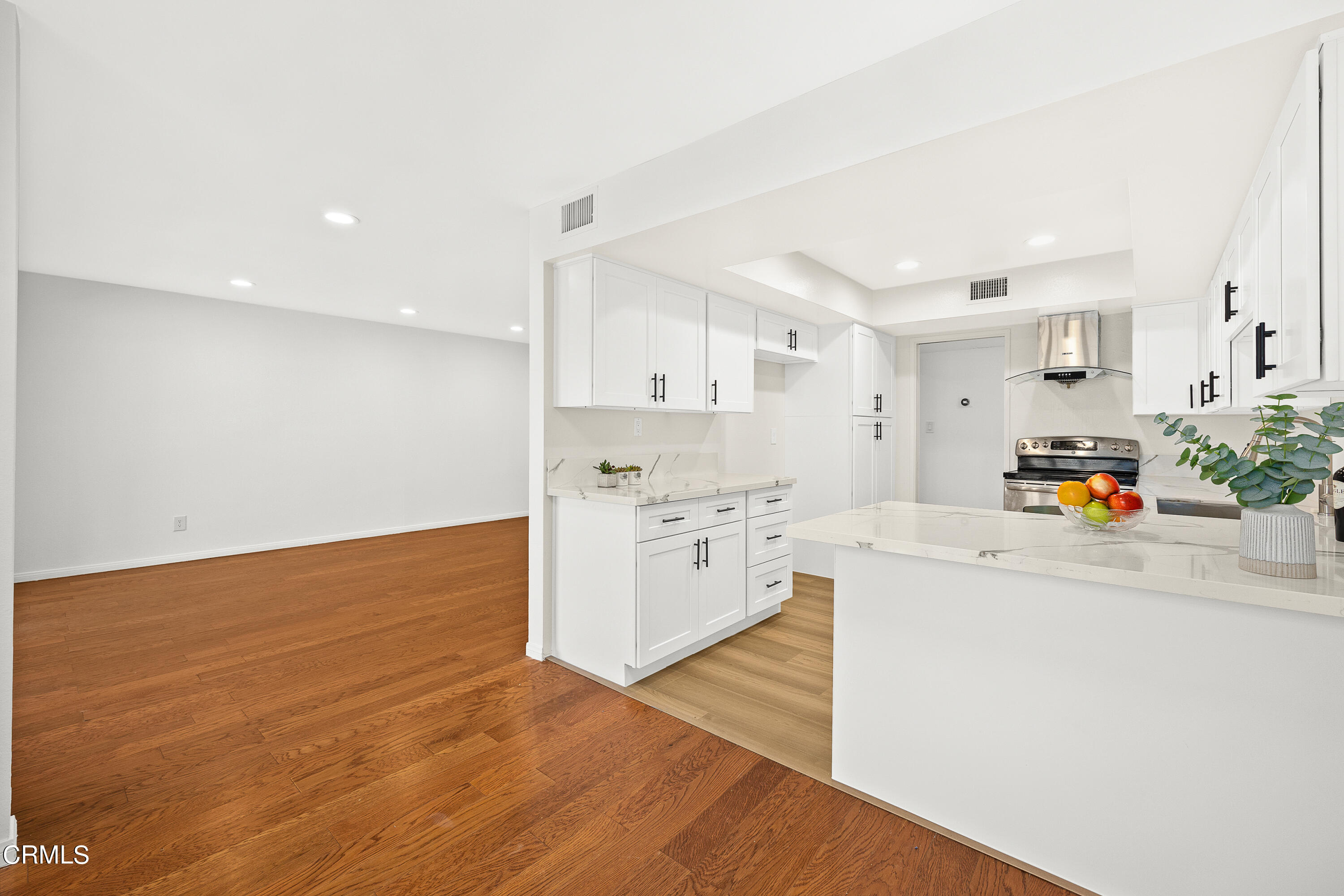 585 West Duarte Road, Unit 24A Arcadia, CA 91007 - Photo 8 of 23 a kitchen with granite countertop a sink cabinets and stainless steel appliances