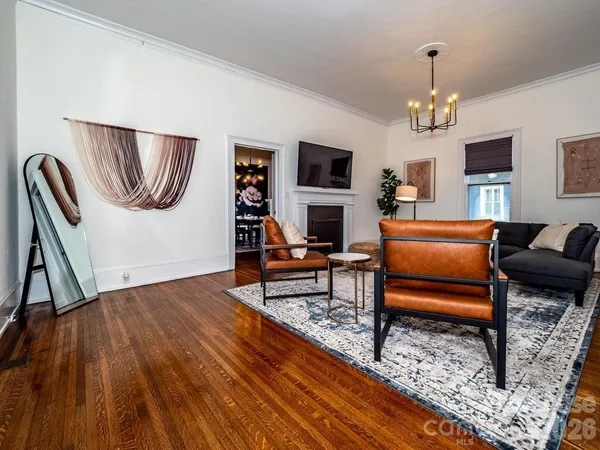 a living room with furniture and a rug