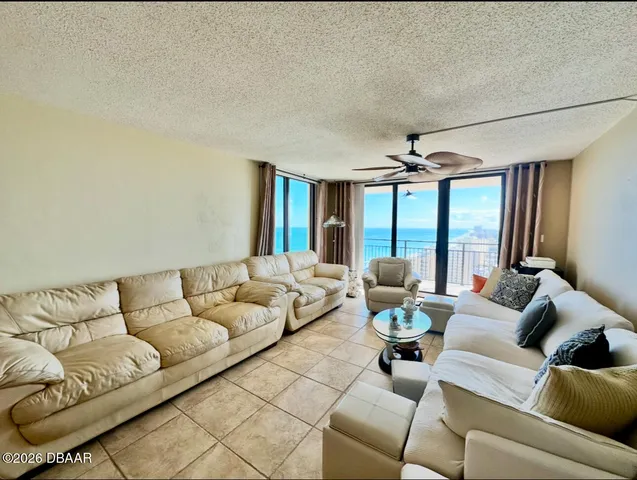 a living room with furniture and a large window