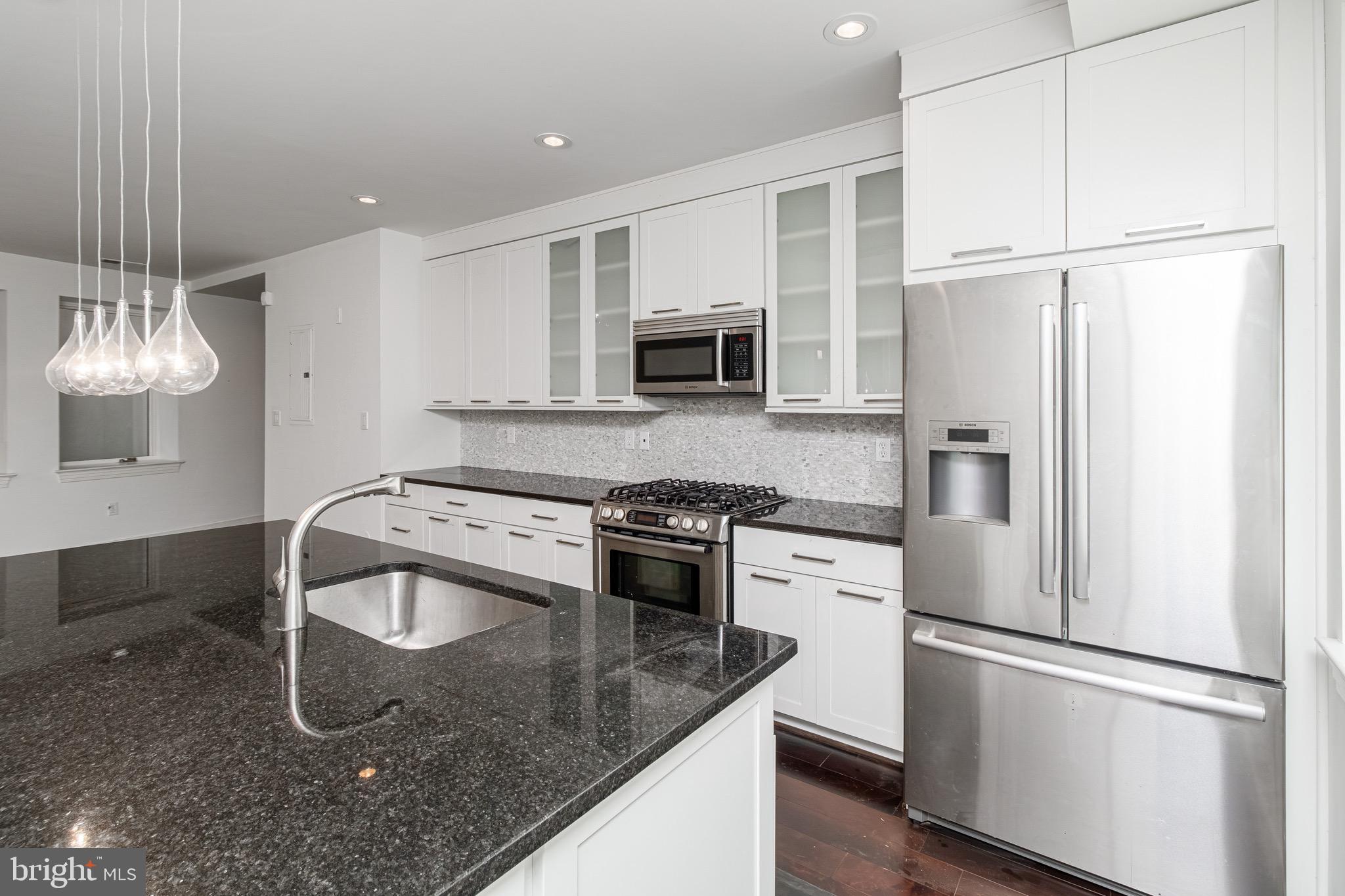 2360 Champlain Street Northwest, Unit B2 Washington, DC 20009 - Photo 10 of 10 a kitchen with a refrigerator sink and stove