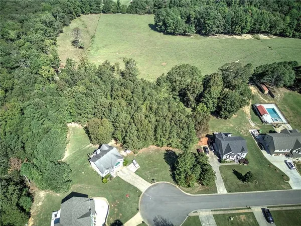 an aerial view of a house having yard