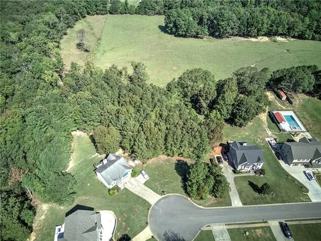 an aerial view of a house having yard